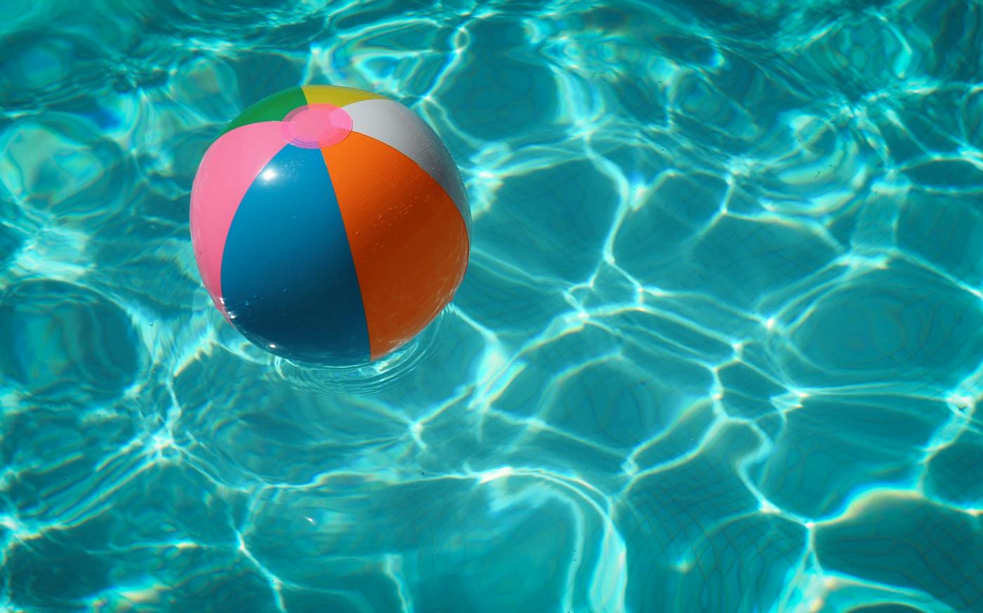 white and multicolored beach ball by Raphaël Biscaldi courtesy of Unsplash.