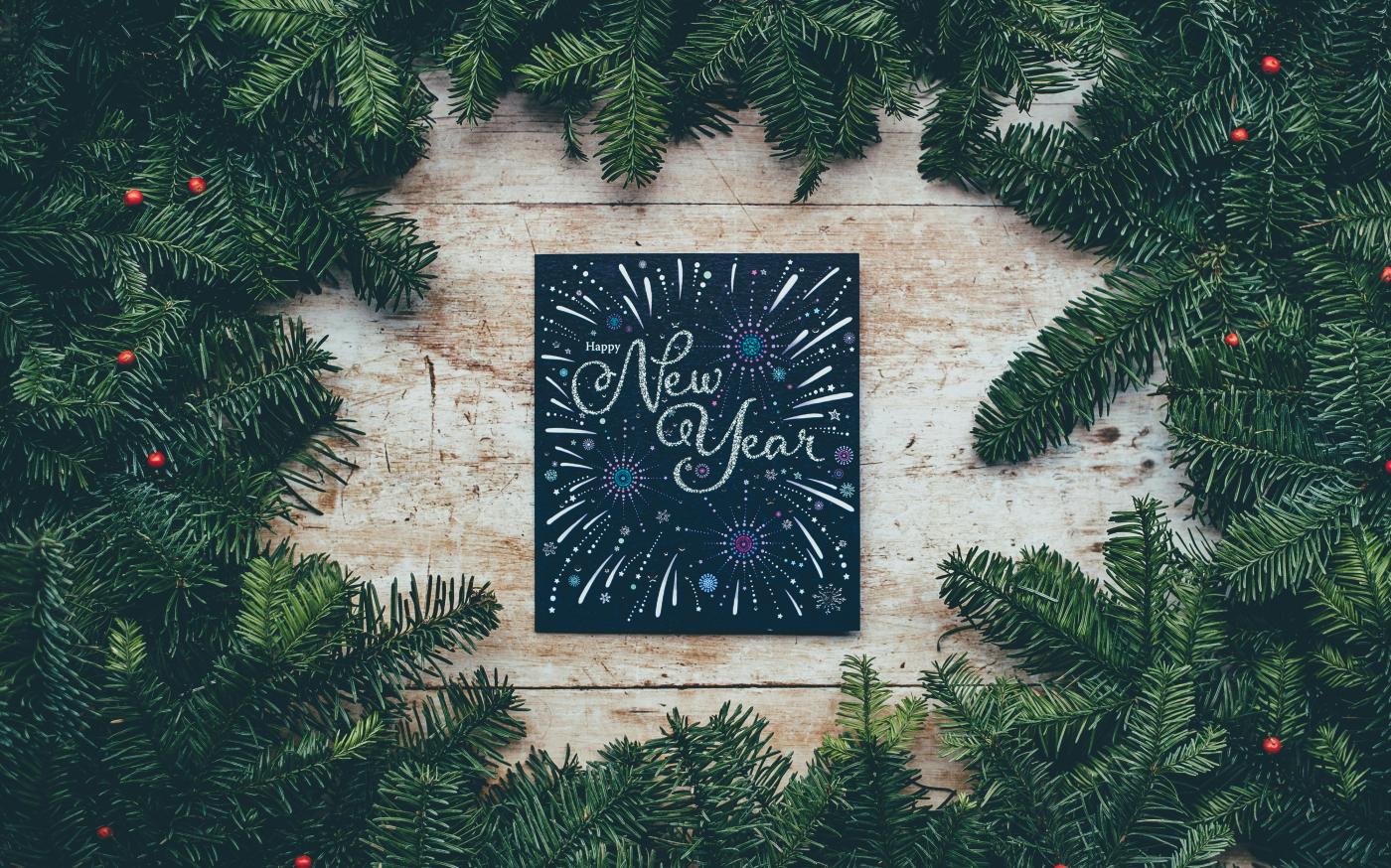 green Christmas decor with New Year greetings by Annie Spratt courtesy of Unsplash.