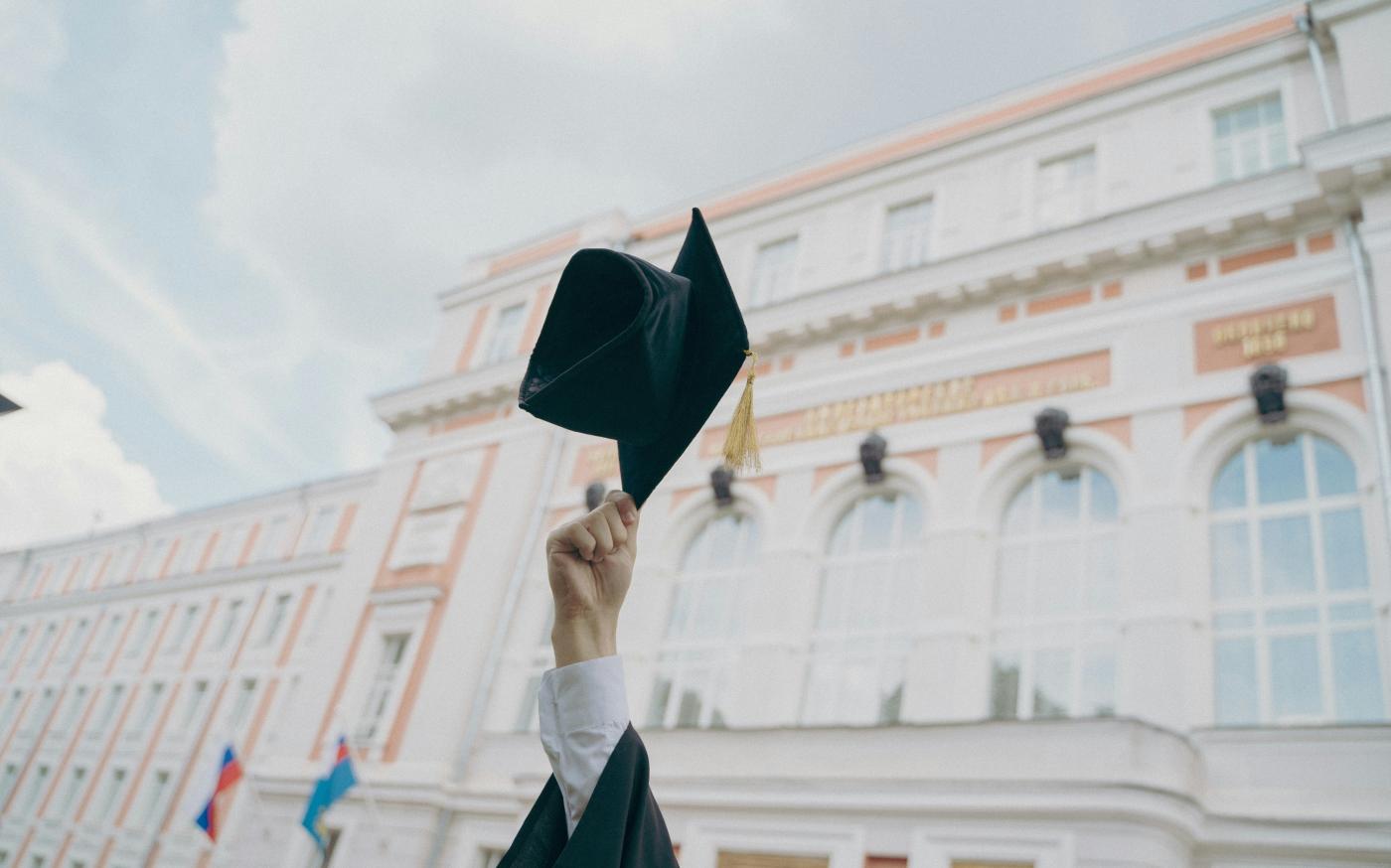 a person holding a black umbrella by RUT MIIT courtesy of Unsplash.