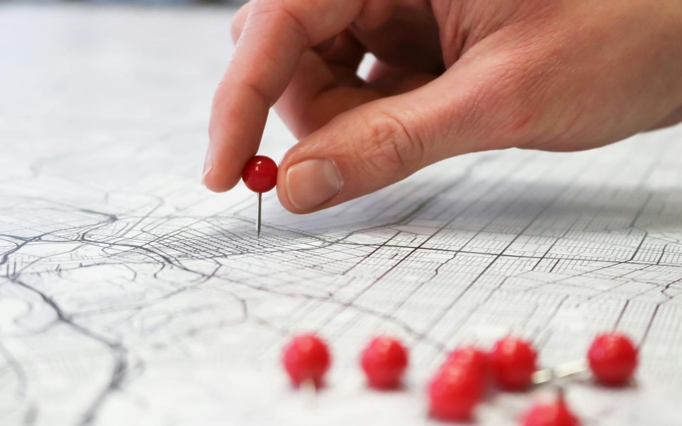 person holding red round medication pill by GeoJango Maps courtesy of Unsplash.