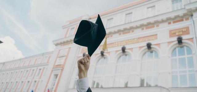 a person holding a black umbrella by RUT MIIT courtesy of Unsplash.