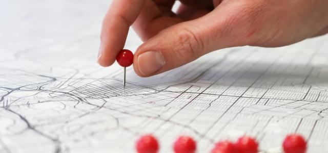 person holding red round medication pill by GeoJango Maps courtesy of Unsplash.